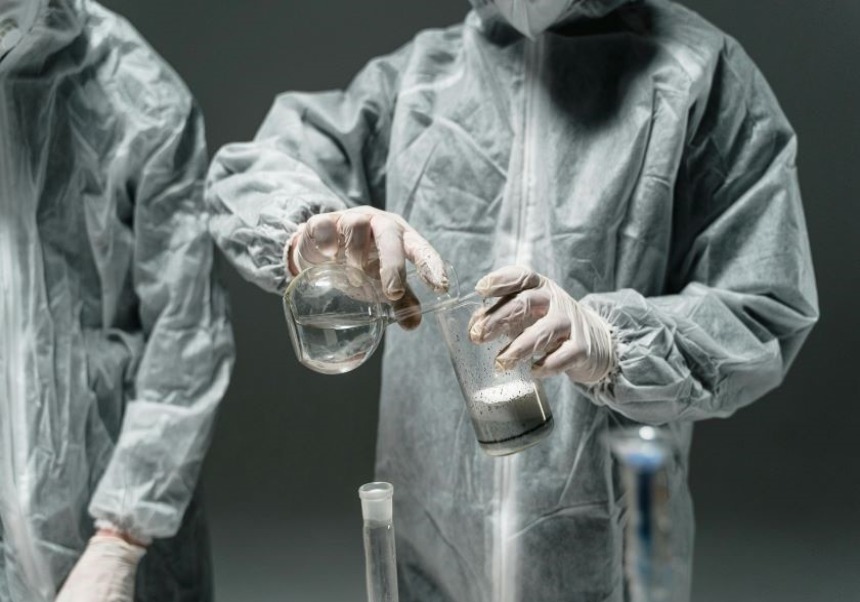 There is a person dressed in biosafety equipment working